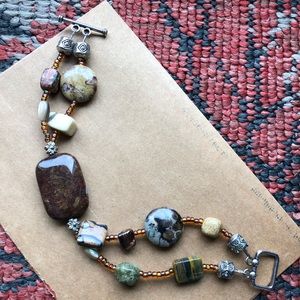 Polished stone and bead bracelet.